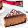 Christmas Chocolate Peppermint Cheesecake with chocolate ganache and candy cane topping