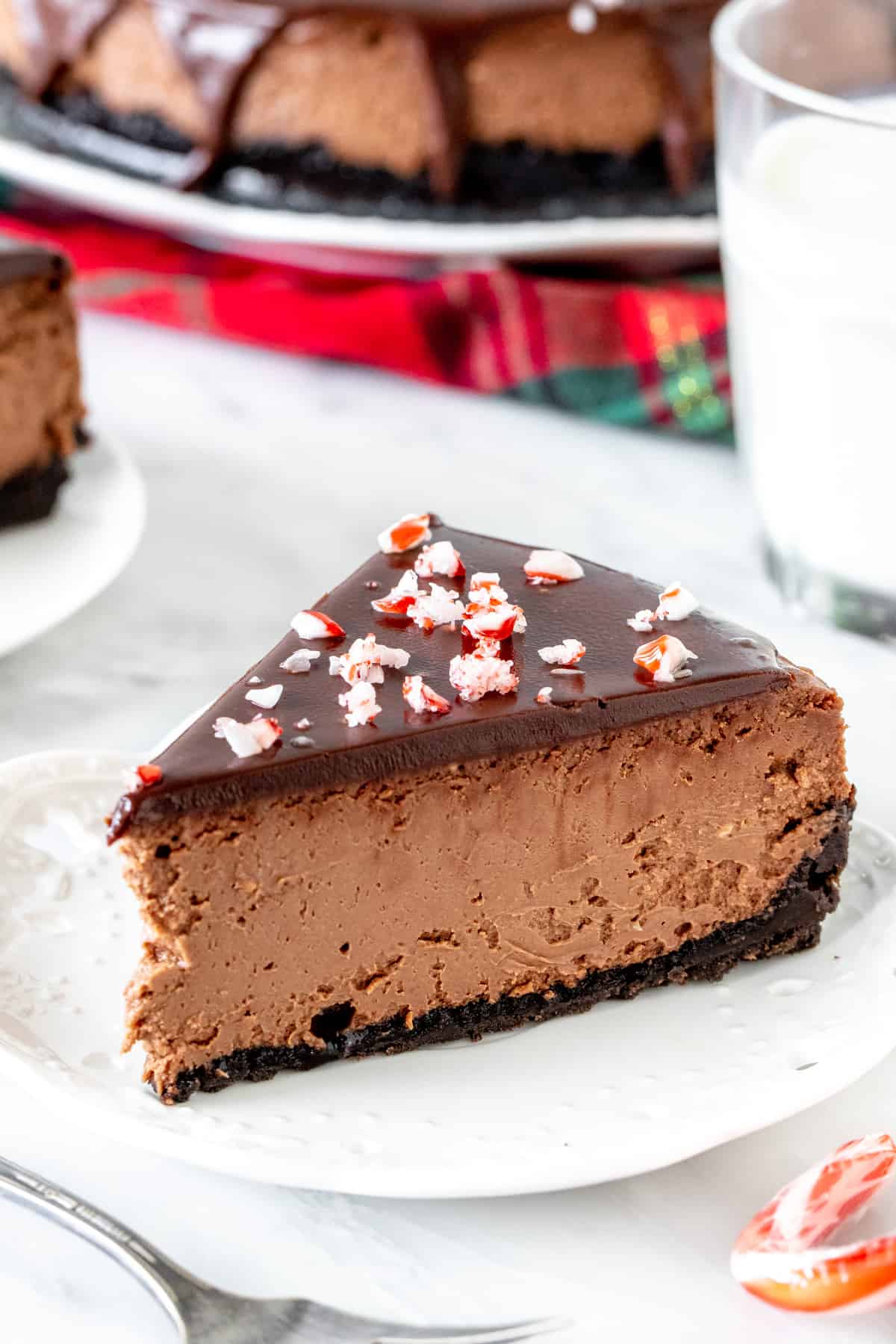 Christmas Chocolate Peppermint Cheesecake with chocolate ganache and candy cane topping