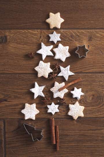 Cinnamon Sugar Snowflake Cookies arranged on a holiday platter