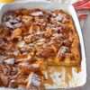 Christmas Morning Eggnog French Toast Casserole topped with powdered sugar