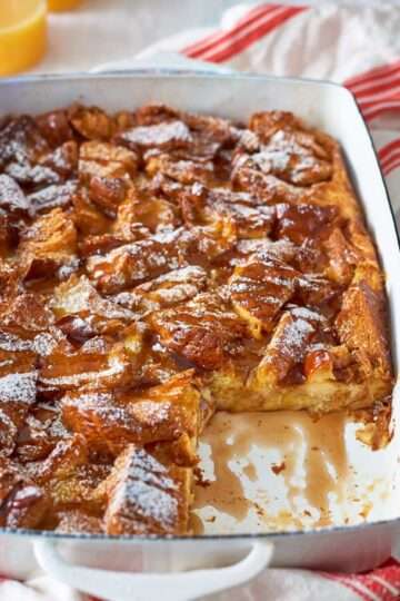 Christmas Morning Eggnog French Toast Casserole topped with powdered sugar