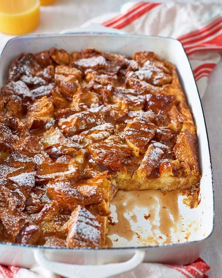 Christmas Morning Eggnog French Toast Casserole topped with powdered sugar