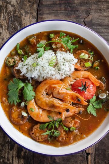 A steaming bowl of authentic Louisiana gumbo with shrimp, sausage, and okra