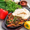 Vibrant sheet pan chicken fajitas with peppers and onions