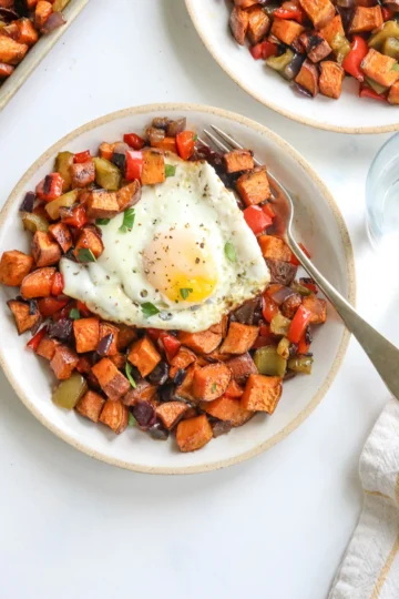 Savory Sweet Potato Breakfast Hash with bacon and peppers in a skillet