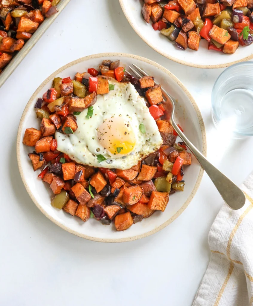 Savory Sweet Potato Breakfast Hash with bacon and peppers in a skillet