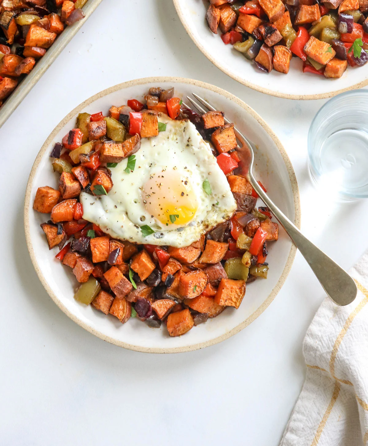 Savory Sweet Potato Breakfast Hash with bacon and peppers in a skillet