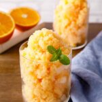 Winter Citrus Granita in a rustic glass, garnished with lemon and orange zest