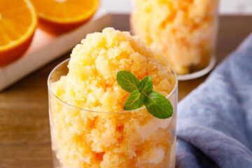 Winter Citrus Granita in a rustic glass, garnished with lemon and orange zest