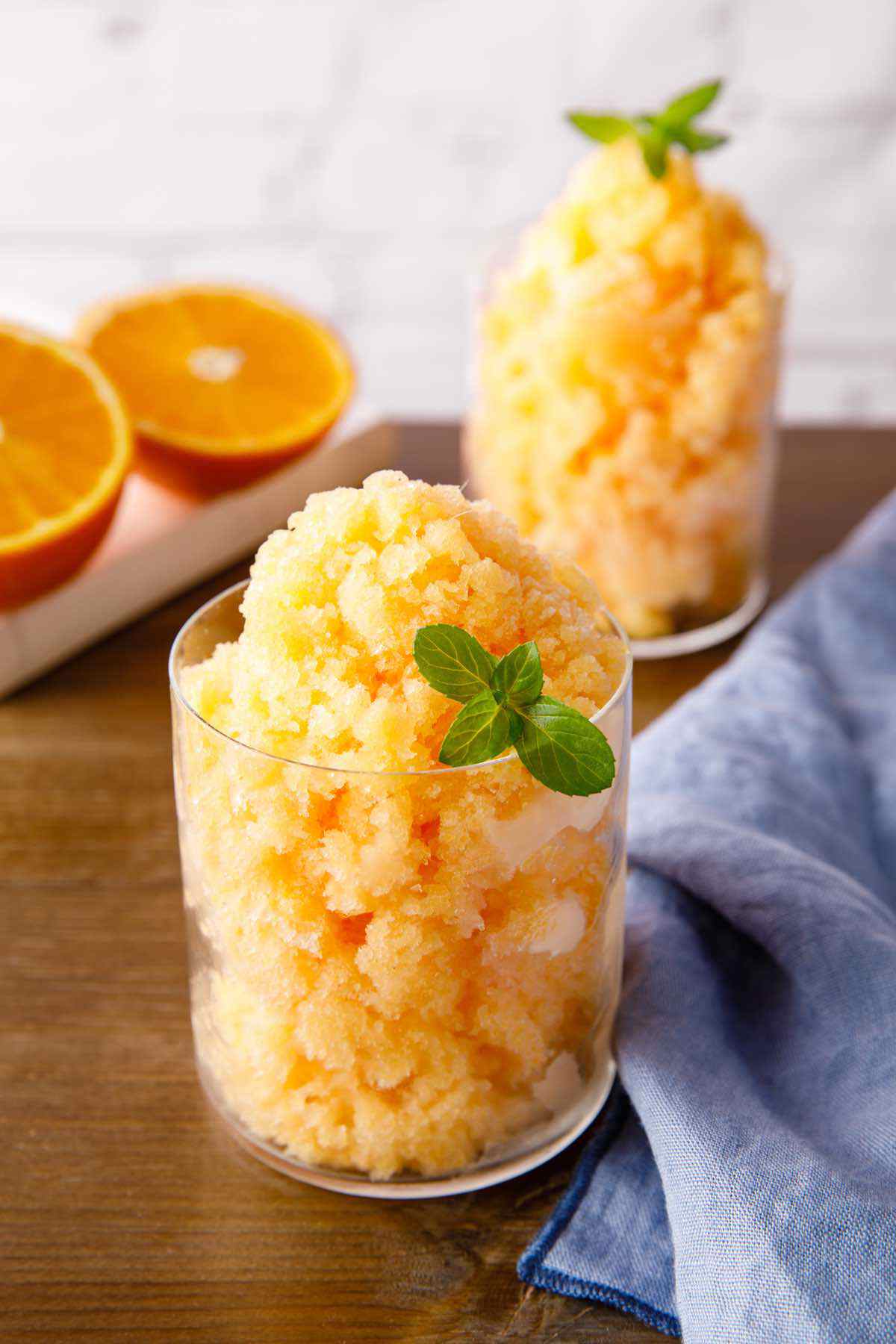 Winter Citrus Granita in a rustic glass, garnished with lemon and orange zest