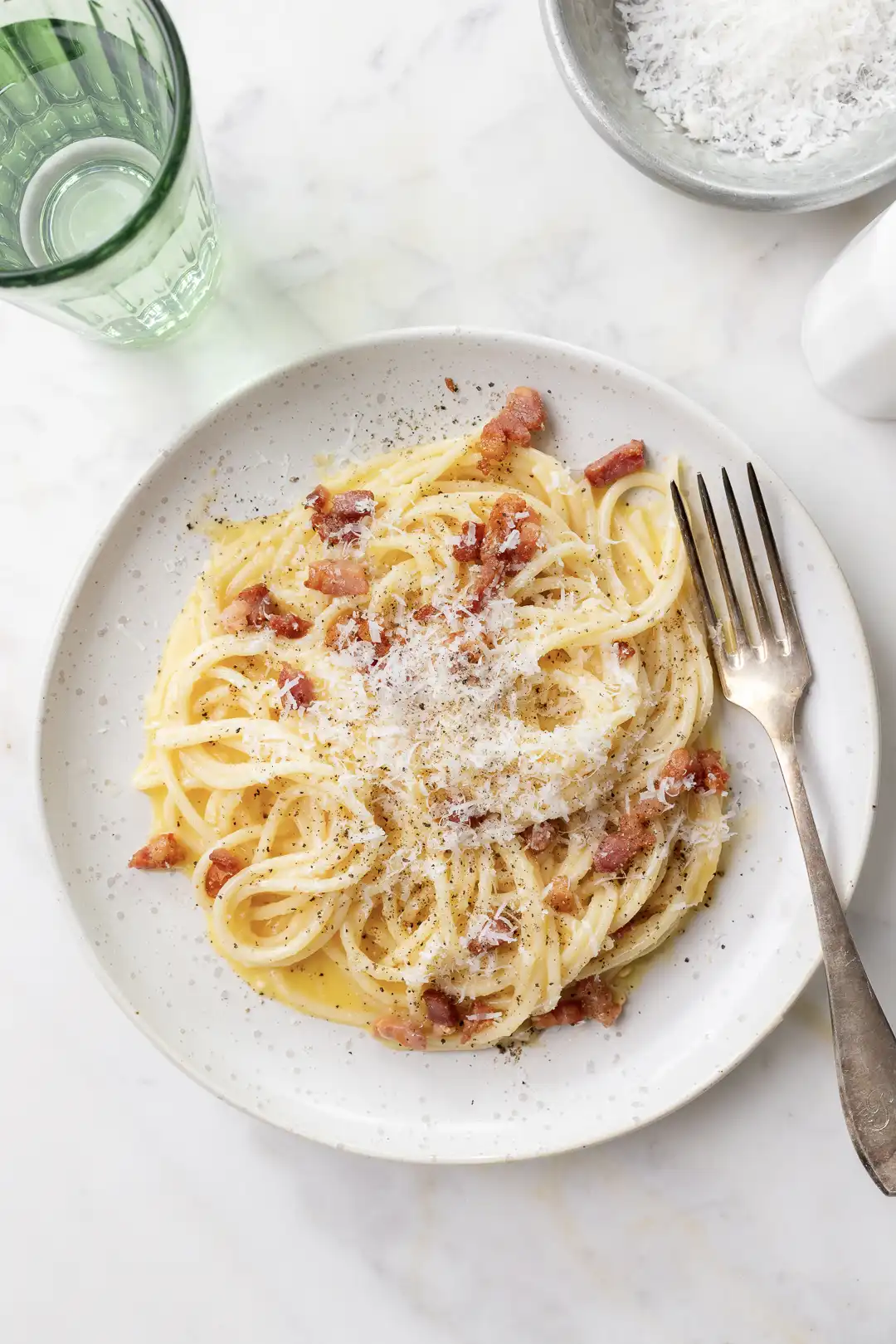 Authentic Spaghetti Carbonara served in a rustic bowl, garnished with parsley and black pepper