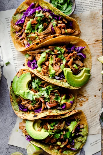 Vegan Jackfruit Tacos with vibrant toppings, fresh salsa, and crisp lettuce