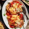 Chicken Parmesan Recipe with golden, crispy chicken and melted cheese on top.