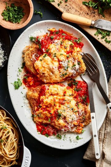 Chicken Parmesan Recipe with golden, crispy chicken and melted cheese on top.