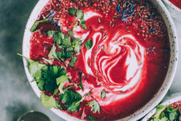 Roasted Beet Soup in a rustic bowl, garnished with a swirl of crème fraîche, fresh dill, and a drizzle of olive oil