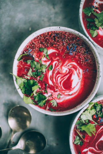 Roasted Beet Soup in a rustic bowl, garnished with a swirl of crème fraîche, fresh dill, and a drizzle of olive oil