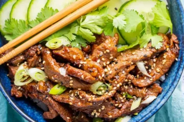 Spicy Korean Beef Bulgogi Bowls with rice and fresh vegetables