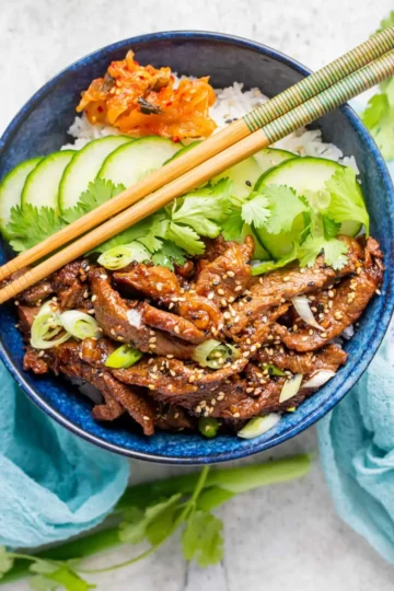 Spicy Korean Beef Bulgogi Bowls with rice and fresh vegetables